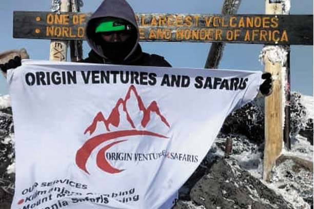 Trekkers celebrating at Uhuru Peak